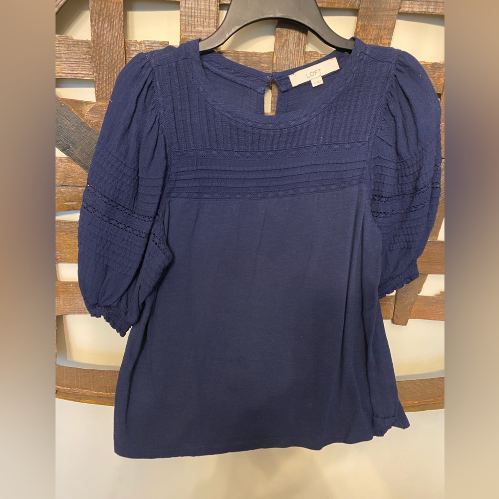 Pretty LOFT navy blue blouse with detailed puff sleeves.